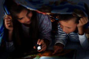 Children reading at night